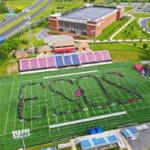 Shenandoah University graduates form the year "2023" at Shentel Stadium